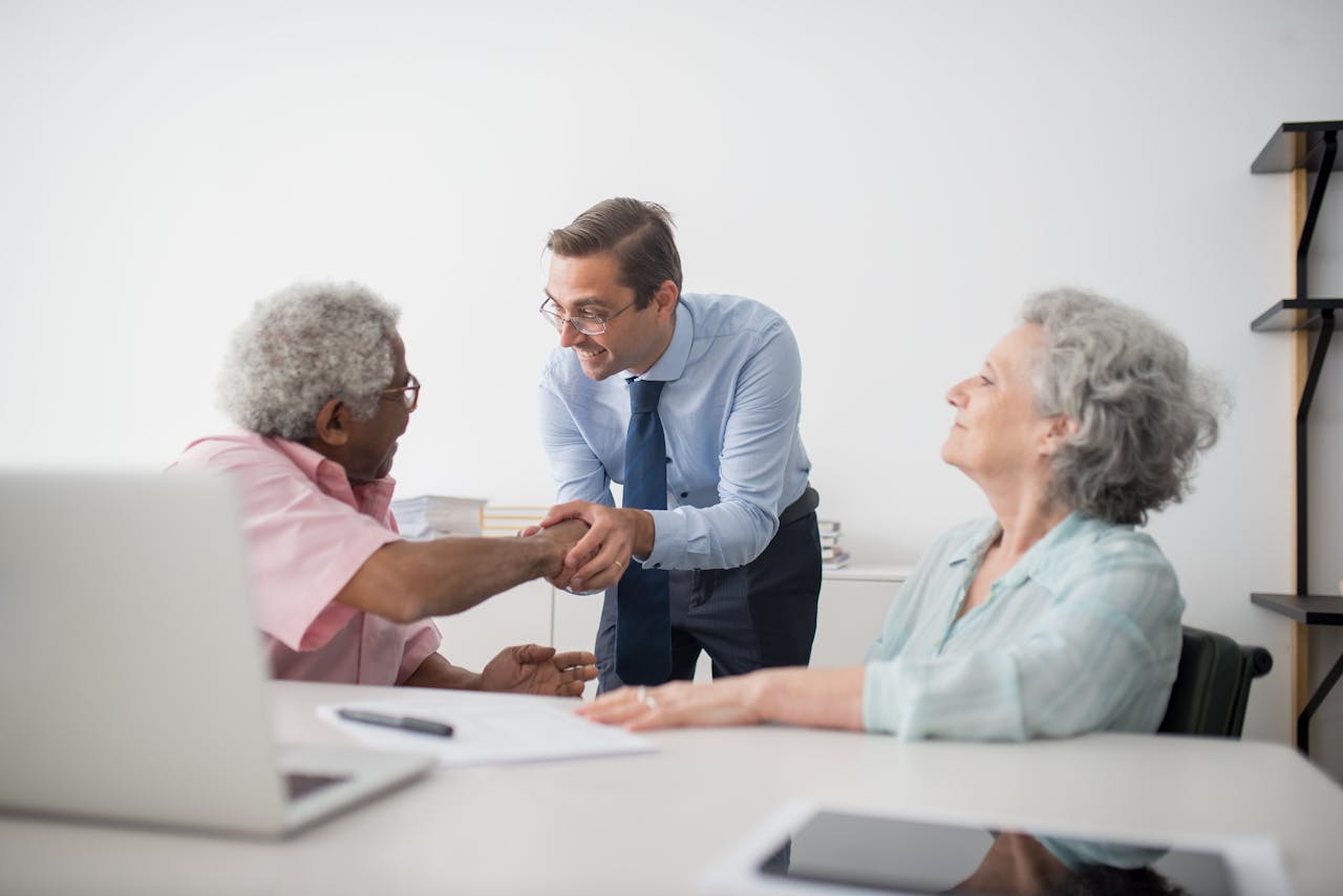 Business advisor greeting clients in a consultation